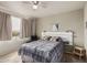 Bright bedroom featuring a queen size bed, large window, and stylish decor at 5401 E Van Buren St # 2053, Phoenix, AZ 85008