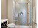 This bathroom features a tiled shower with a built-in niche, sleek fixtures, and a tiled floor at 5411 E Duane Ln, Cave Creek, AZ 85331