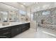 Modern bathroom with dual vanity, a glass-enclosed shower and contemporary finishes at 5411 E Duane Ln, Cave Creek, AZ 85331