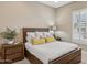 This bedroom features wood furniture, neutral walls, carpeted floors, and large windows with plantation shutters at 5411 E Duane Ln, Cave Creek, AZ 85331