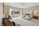 Bright, spacious main bedroom featuring large windows, neutral décor and modern ceiling fan at 5411 E Duane Ln, Cave Creek, AZ 85331