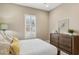 This bedroom features wood furniture, neutral walls, carpeted floors, and large windows with plantation shutters at 5411 E Duane Ln, Cave Creek, AZ 85331