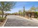 Gated community entrance offering privacy and security, set amidst desert landscaping at 5411 E Duane Ln, Cave Creek, AZ 85331