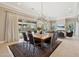 Dining area with a large table, stylish lighting, and views of the outdoor space at 5411 E Duane Ln, Cave Creek, AZ 85331