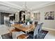 Bright dining room features a modern chandelier and transitions into the open kitchen area at 5411 E Duane Ln, Cave Creek, AZ 85331