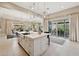 Bright kitchen island with a sink, bar seating, and stainless steel dishwasher at 5411 E Duane Ln, Cave Creek, AZ 85331