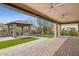 Spacious covered patio overlooking an outdoor kitchen, artificial turf lawn, and desert landscaping at 5411 E Duane Ln, Cave Creek, AZ 85331