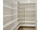 Spacious walk-in pantry with ample shelving for optimal organization and storage at 5411 E Duane Ln, Cave Creek, AZ 85331