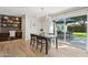 Bright dining room features a modern chandelier, sliding doors to the backyard, and a built-in workspace at 5529 N 19Th St, Phoenix, AZ 85016