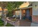 Inviting front porch with brick accents, comfortable seating, and vibrant potted flowers for a welcoming ambiance at 5529 N 19Th St, Phoenix, AZ 85016