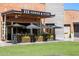 Horse & Hyde restaurant patio featuring outdoor seating, a black awning, and manicured green lawn at 5529 N 19Th St, Phoenix, AZ 85016