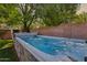 This backyard features an in-ground spa with a stone surround and water features at 5529 N 19Th St, Phoenix, AZ 85016