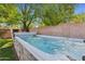 This backyard features an in-ground spa with a stone surround and water features at 5529 N 19Th St, Phoenix, AZ 85016