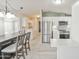 Bright and airy kitchen adjacent to a dining area and leading to laundry room at 5735 E Mcdowell Rd # 197, Mesa, AZ 85215