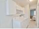 Dedicated laundry room includes full size washer and dryer and storage cabinets at 5735 E Mcdowell Rd # 197, Mesa, AZ 85215