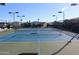 Another view of the tennis court featuring new paint and lights for evening enjoyment and play at 5735 E Mcdowell Rd # 197, Mesa, AZ 85215