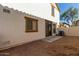 A private backyard area featuring low maintenance gravel, an AC unit, and privacy fence at 5828 E Hoover Ave, Mesa, AZ 85206
