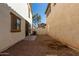 View of the private backyard area with low maintenance gravel, AC unit, and fenced yard at 5828 E Hoover Ave, Mesa, AZ 85206