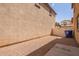 Small backyard area with gravel, partial concrete slab, and a privacy fence at 5828 E Hoover Ave, Mesa, AZ 85206