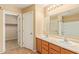 Bathroom features double sink vanity and an adjacent door to the walk-in closet at 5828 E Hoover Ave, Mesa, AZ 85206