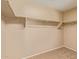 Walk-in closet with custom shelving and plenty of storage at 5828 E Hoover Ave, Mesa, AZ 85206