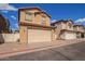 Two story home with two car garage and gravel landscaping in a suburban neighborhood at 5828 E Hoover Ave, Mesa, AZ 85206