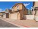 Two story home with two car garage and gravel landscaping on a sunny day at 5828 E Hoover Ave, Mesa, AZ 85206