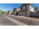 Charming townhomes featuring private garages and beautifully maintained neighborhood street view at 5828 E Hoover Ave, Mesa, AZ 85206