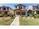Charming two-story home featuring a stucco exterior, brown shutters, and a well-maintained landscaped front yard at 5828 E Hoover Ave, Mesa, AZ 85206