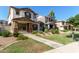 Charming two-story home featuring a stucco exterior, brown shutters, and a well-maintained landscaped front yard at 5828 E Hoover Ave, Mesa, AZ 85206