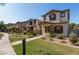 Charming two-story home featuring a stucco exterior, brown shutters, and a well-maintained landscaped front yard at 5828 E Hoover Ave, Mesa, AZ 85206
