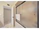 Bathroom shower featuring a sliding glass door and tile flooring at 6309 E Crocus Dr, Scottsdale, AZ 85254