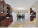 Elegant dining room with stylish chandelier, seating for six, and lovely travertine floors at 6309 E Crocus Dr, Scottsdale, AZ 85254