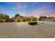 Inviting single-story home with desert landscaping, neutral paint, and a spacious two-car garage at 6309 E Crocus Dr, Scottsdale, AZ 85254