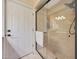 Glass enclosed shower featuring tiled walls and floors and updated shower fixtures at 6309 E Crocus Dr, Scottsdale, AZ 85254