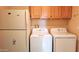 Convenient laundry area with a fridge, washer, and dryer appliances at 8020 E Keats Ave # 271, Mesa, AZ 85209