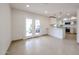 Open-concept kitchen adjacent to a living area, featuring modern appliances and access to an outdoor patio at 8442 E Chaparral Rd, Scottsdale, AZ 85250