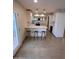 Bright kitchen showcasing white cabinetry, stylish bar stools, and a modern layout, perfect for entertaining at 8442 E Chaparral Rd, Scottsdale, AZ 85250