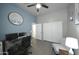 Bedroom with neutral wall paint, a ceiling fan, and a gray wood desk at 888 E Sheffield Ave, Chandler, AZ 85225