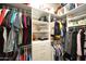 Organized closet features hanging clothes, built-in shelving and drawers for optimal storage at 888 E Sheffield Ave, Chandler, AZ 85225