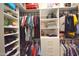 Organized walk-in closet features shelving and hanging clothes at 888 E Sheffield Ave, Chandler, AZ 85225