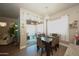 A brightly lit dining area with sliding glass doors that lead to an outdoor patio at 888 E Sheffield Ave, Chandler, AZ 85225