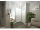 Bright foyer features a modern light fixture, neutral walls, and wood-look floors, offering a welcoming entrance at 888 E Sheffield Ave, Chandler, AZ 85225