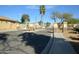 Gated community entrance with secure access, stone pillars, and well-maintained landscaping at 888 E Sheffield Ave, Chandler, AZ 85225