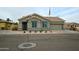 Charming single-story home with desert landscaping, a two car garage, and a flagpole with an American flag at 888 E Sheffield Ave, Chandler, AZ 85225