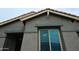 Detailed view of a window showing the architectural details and the texture of the siding at 888 E Sheffield Ave, Chandler, AZ 85225