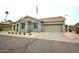 Charming single-story home with desert landscaping, a two car garage, and a flagpole with an American flag at 888 E Sheffield Ave, Chandler, AZ 85225