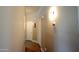 Hallway with neutral walls and wood-look floors leading to various rooms at 888 E Sheffield Ave, Chandler, AZ 85225