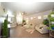 Living room with neutral walls, ceiling fan, wood floors and comfortable seating arrangement at 888 E Sheffield Ave, Chandler, AZ 85225