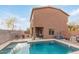 Inviting backyard oasis featuring a sparkling pool, covered patio, and mature landscaping, perfect for relaxing and entertaining at 900 W Broadway Ave # 66, Apache Junction, AZ 85120